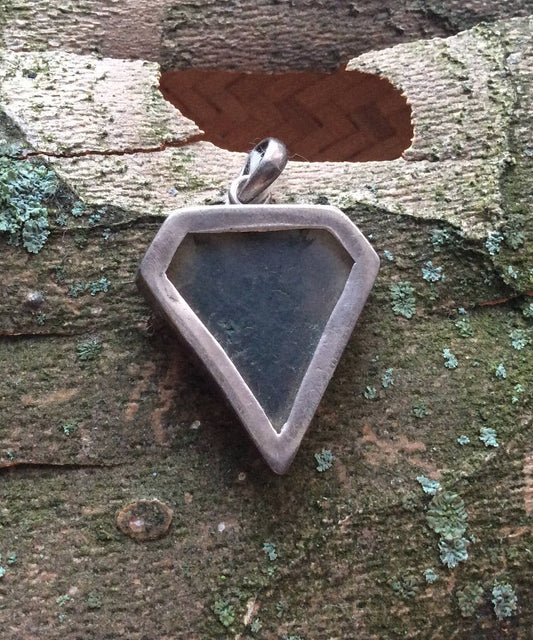 Moss Agate held in Silver Surround